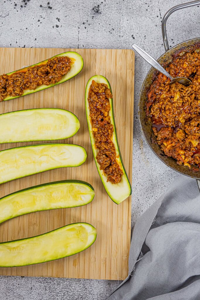 Keto Zucchini boats being stuffed - Yummy Keto Cooking Keto Zucchini boats being stuffed - Yummy Keto Cooking