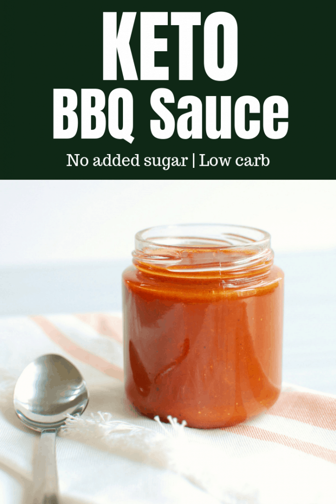 A small jar of keto bbq sauce next to a spoon A small jar of keto bbq sauce next to a spoon