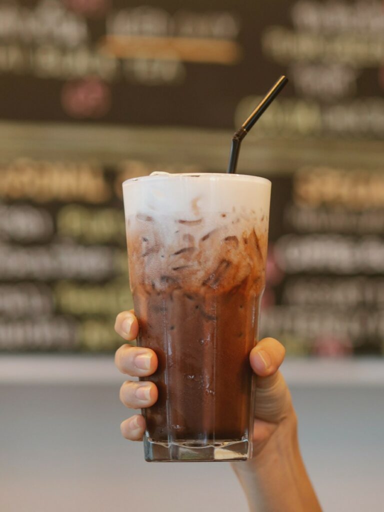 Keto coffee with sweet cream cold foam in a glass Keto coffee with sweet cream cold foam in a glass