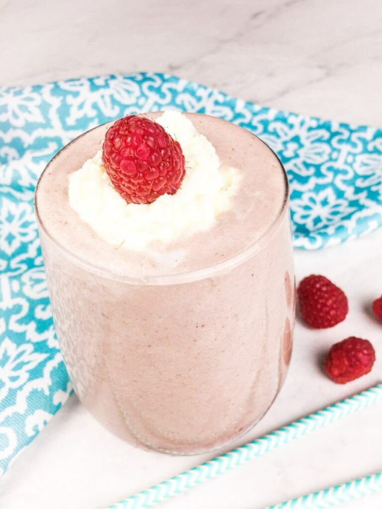 A glass filled with a low carb raspberry smoothie A glass filled with a low carb raspberry smoothie