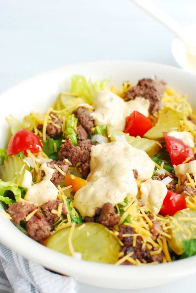 a closeup of a bowl of low carb big mac salad a closeup of a bowl of low carb big mac salad