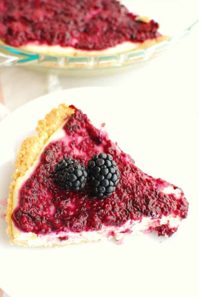 a slice of low carb blackberry cheesecake on a plate a slice of low carb blackberry cheesecake on a plate