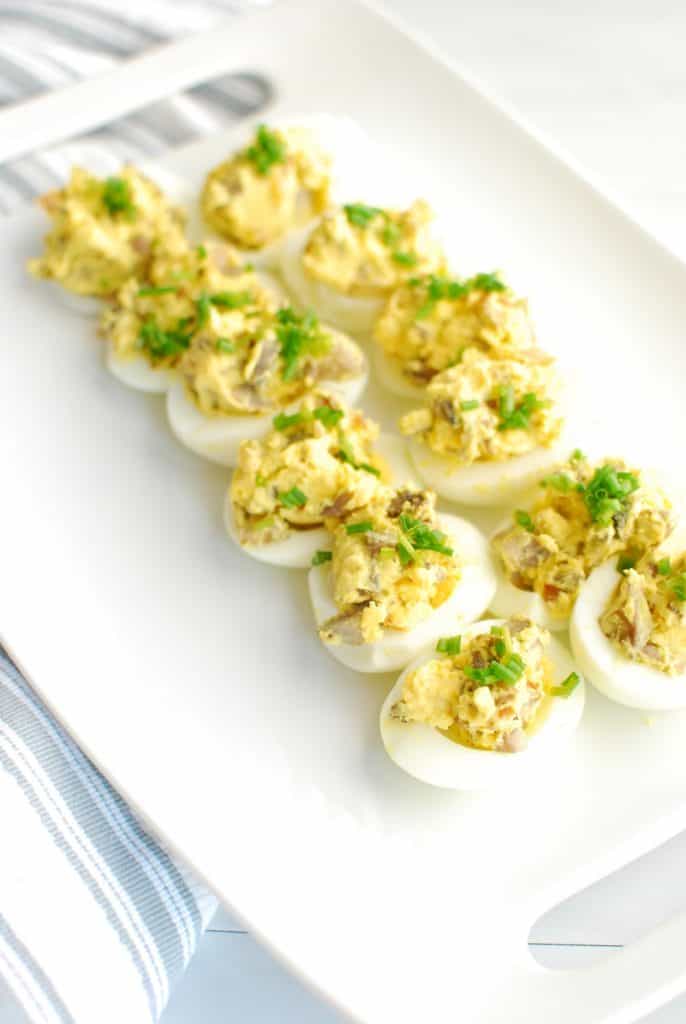 12 keto deviled eggs on a white platter 12 keto deviled eggs on a white platter