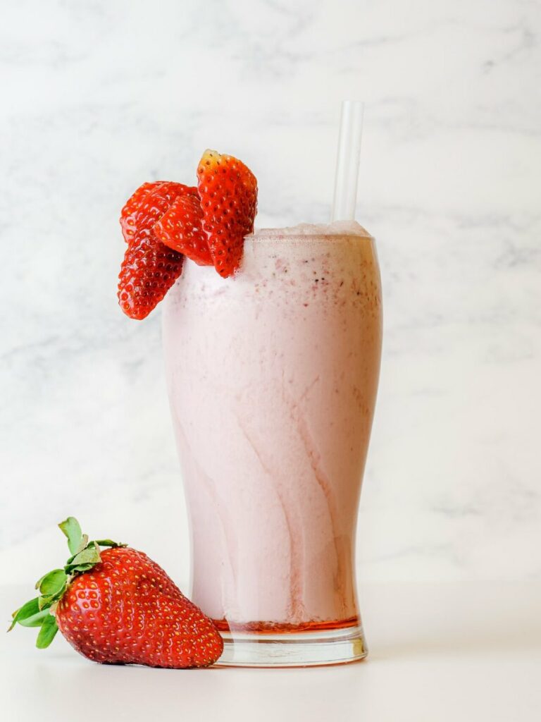 Keto Pink Drink in Glass with Strawberries - YKC Low Carb Version Keto Pink Drink in Glass with Strawberries - YKC Low Carb Version