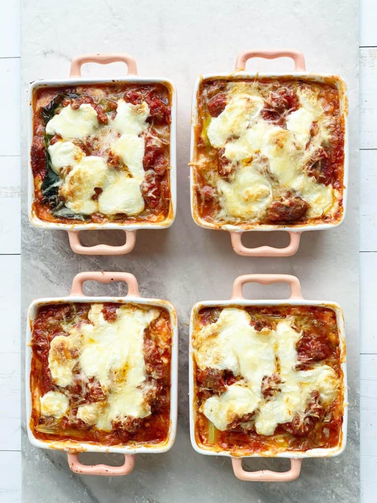 four ramekins full of cabbage lasagna four ramekins full of cabbage lasagna