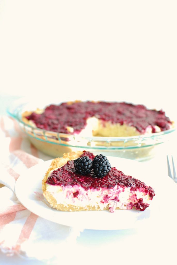 a slice of keto blackberry cheesecake on a plate a slice of keto blackberry cheesecake on a plate