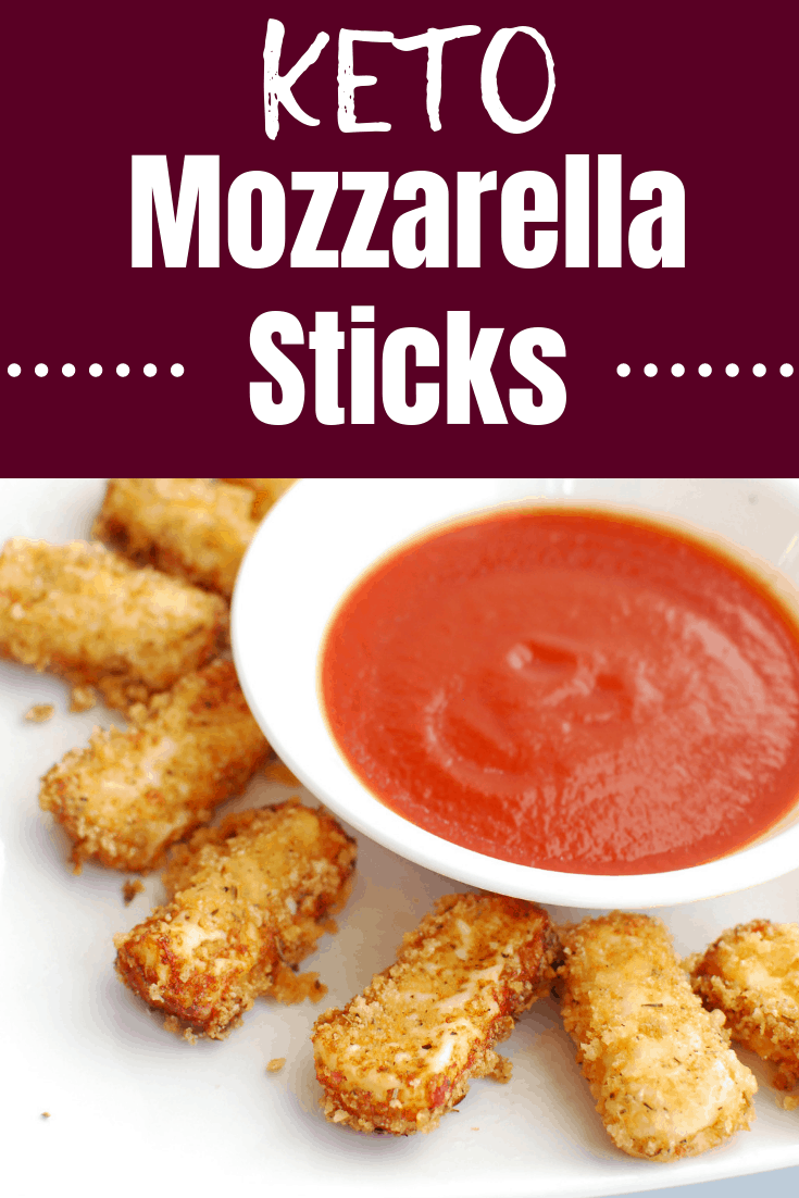 A tray of keto mozzarella sticks along with marinara sauce A tray of keto mozzarella sticks along with marinara sauce