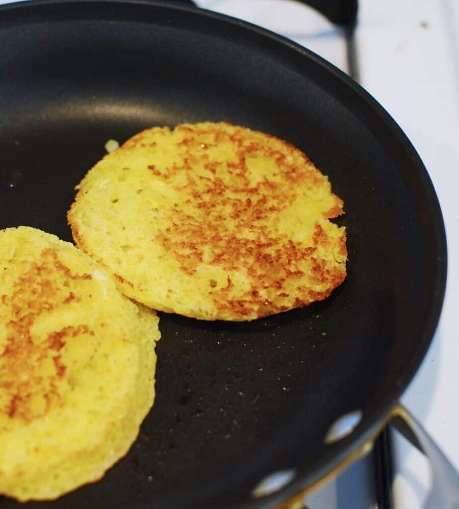 a skillet with keto bread in it being toasted a skillet with keto bread in it being toasted