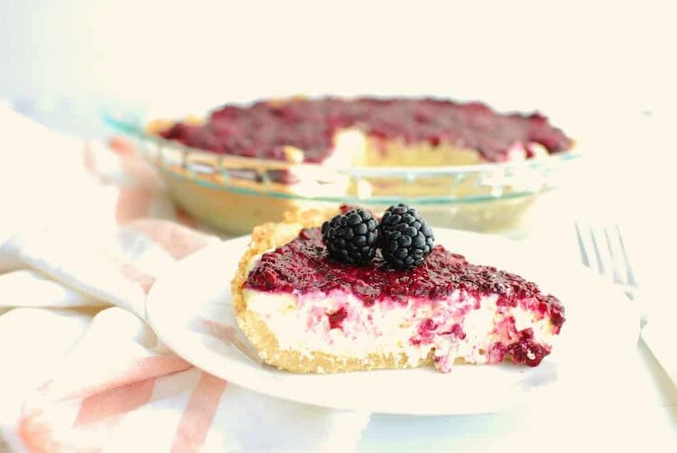 a slice of keto blackberry cheesecake on a plate