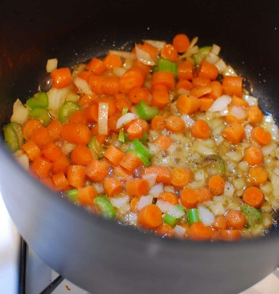 Vegetables cooking in a pot in bacon grease Vegetables cooking in a pot in bacon grease