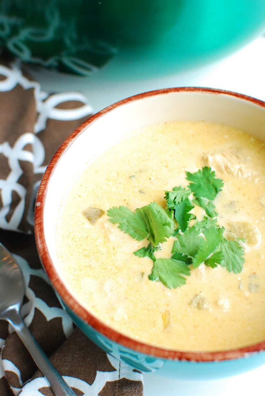 keto white chicken chili in a bowl next to a brown napkin keto white chicken chili in a bowl next to a brown napkin