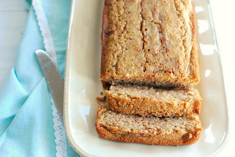 a sliced loaf of keto cinnamon bread on a beige plate