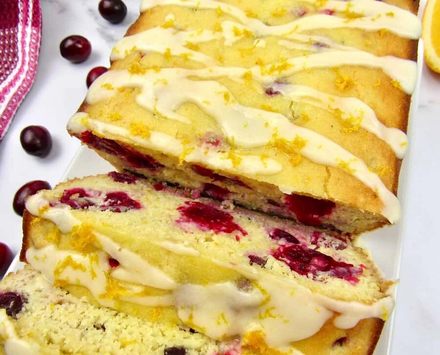 keto cranberry orange bread on a white plate keto cranberry orange bread on a white plate